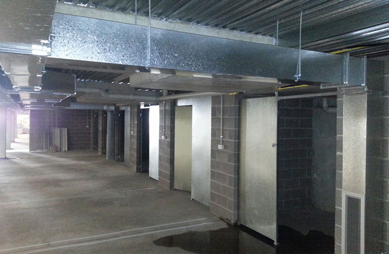 A car park extraction system was installed as per Mechanical Design. The sheet metal ducting had high and low level grilles and was controlled with a Variable Speed drive and Roof Mounted Fantech Fan. 2 x CO2 (Carbon Dioxide) sensors contolled the fan and fire dampers were required through the slab penetrations.