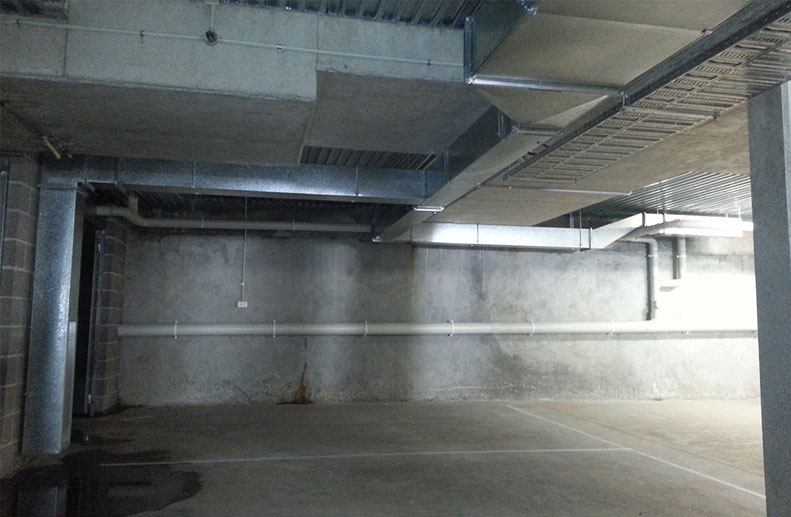 A car park extraction system was installed as per Mechanical Design. The sheet metal ducting had high and low level grilles and was controlled with a Variable Speed drive and Roof Mounted Fantech Fan. 2 x CO2 (Carbon Dioxide) sensors contolled the fan and fire dampers were required through the slab penetrations.