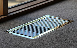 heating duct, metal frame on brown carpet