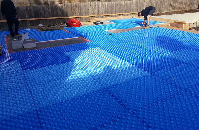 Placement of blue foam for In Screed Hydronic heating in Ivanhoe.