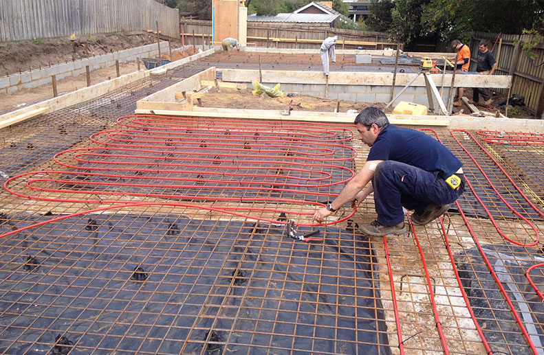 Red Rehau Hydronic pex a piping with 200mm centres prior to concrete pour for Hydronic Heating System