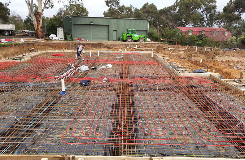 A Large double storey home with Red Rehau hydronic Pex A pipe before concrete pour for Hydronic heating system in Lower Plenty