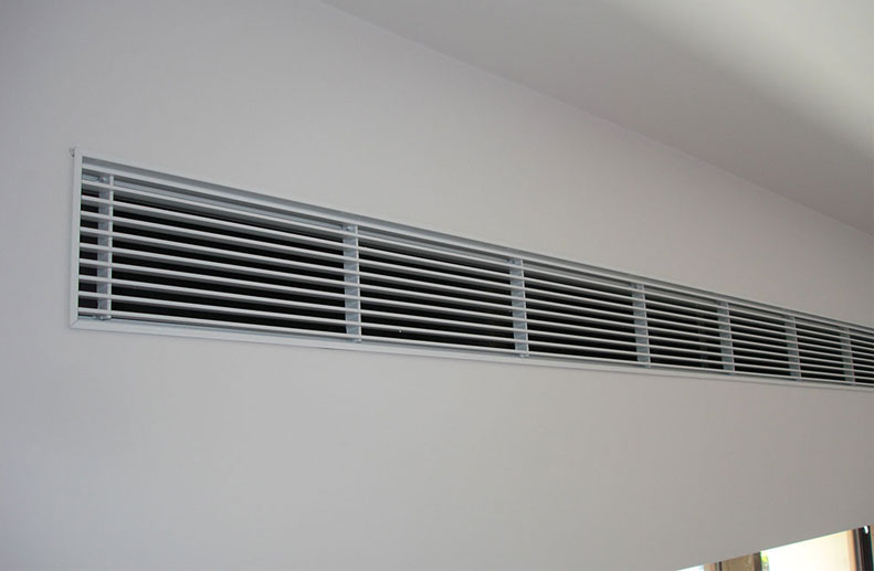 Flangless linear bar grille in bulkhead wall in St Kilda renovation installed to LG 3 phase ducted air conditioner