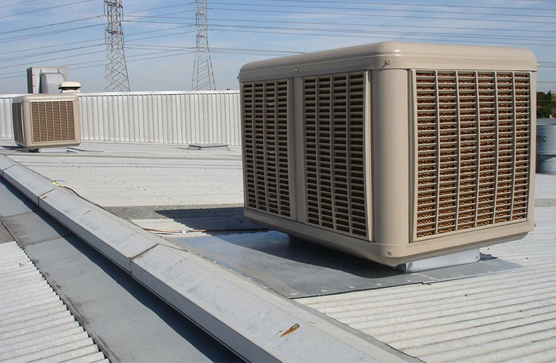 Commercial evaporative cooling installation in Thomastown warehouse. Two Coolbreeze D500 twin fan evap coolers to plenum outlets.