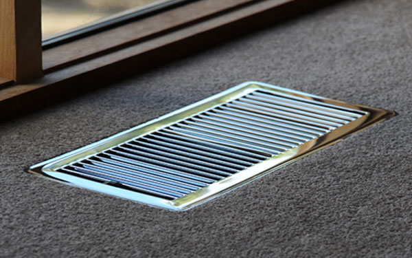 heating duct, metal frame on brown carpet