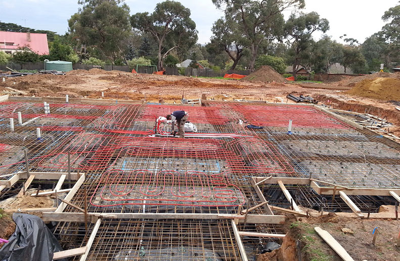 A Large double storey home with Red Rehau hydronic Pex A pipe before concrete pour for Hydronic heating system in Lower Plenty