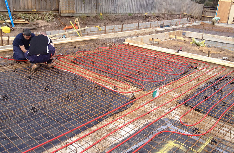 Red Rehau Hydronic pex a piping with 200mm centres prior to concrete pour for Hydronic Heating System