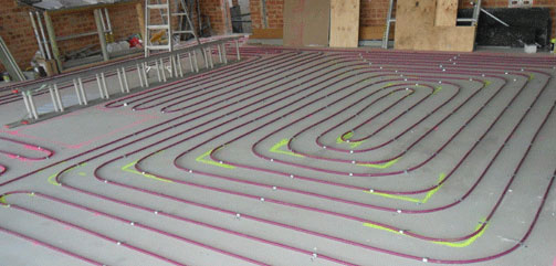 purple piping for hydronic heating in screed on grey surface