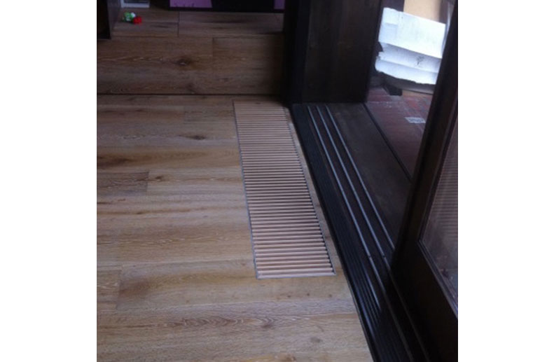 A custom Jaga trench convector was installed in front of the fixed pane of glass in an Architects home. The top grille timber was Oak to match the finished floor boards. The rest of the installation had De Longhi Steel radiator panels and a Bosch Condensing boiler.