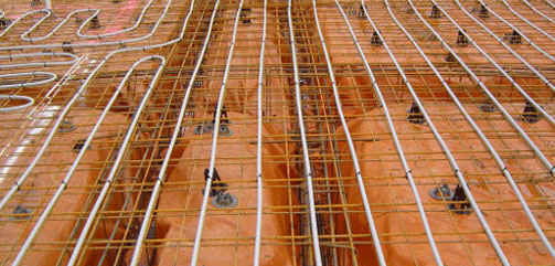 in slab installation of hydronic heating before concrete slab has been poured