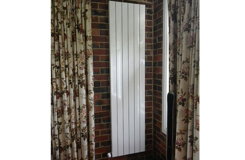 Hydronic heating radiator panels had vertical aluminium “Oscar” radiator panels to fit between the limited width wall space in croydon home
